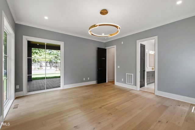 2805 Van Dyke Ave, Raleigh, NC 27607 - unfurnished room with plenty of natural light, a chandelier, crown molding, light wood-style floors, and recessed lighting