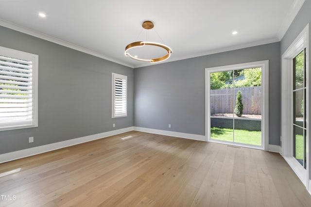 2805 Van Dyke Ave, Raleigh, NC 27607 - spare room featuring ornamental molding, baseboards, healthy amount of natural light, light wood-style flooring, and recessed lighting