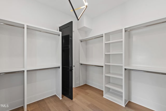 2805 Van Dyke Ave, Raleigh, NC 27607 - spacious closet featuring wood finished floors and a chandelier
