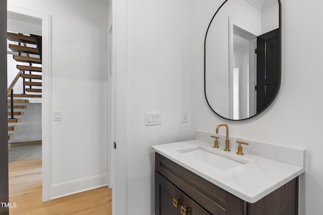 2805 Van Dyke Ave, Raleigh, NC 27607 - bathroom with wood finished floors, vanity, and baseboards