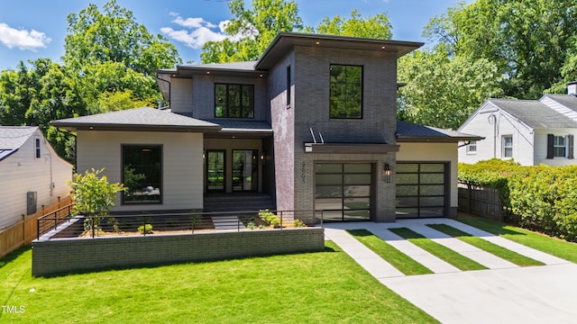 2805 Van Dyke Ave, Raleigh, NC 27607 - back of property with concrete driveway, brick siding, and an attached garage