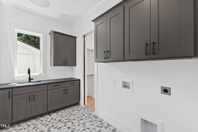 2805 Van Dyke Ave, Raleigh, NC 27607 - laundry area featuring cabinet space, electric dryer hookup, washer hookup, crown molding, and light floors