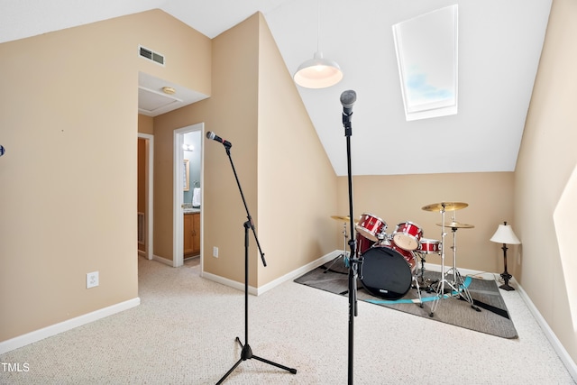 102 Legacy Ln, Durham, NC 27713 - playroom with vaulted ceiling, a skylight, baseboards, and carpet flooring
