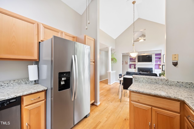 102 Legacy Ln, Durham, NC 27713 - kitchen featuring appliances with stainless steel finishes, decorative columns, a fireplace, light wood finished floors, and high vaulted ceiling