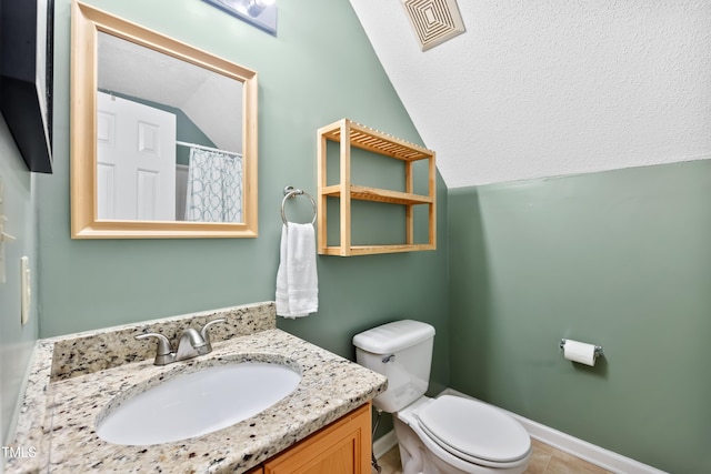 102 Legacy Ln, Durham, NC 27713 - full bathroom featuring vaulted ceiling, vanity, toilet, and baseboards