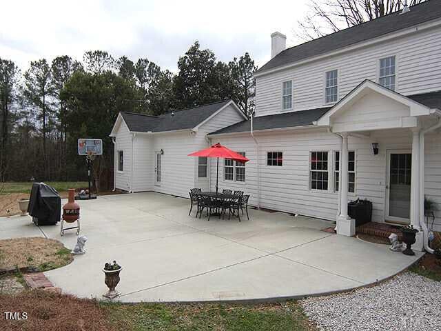 100 Lager Ln, Garner, NC 27529 - back of house with a chimney and a patio