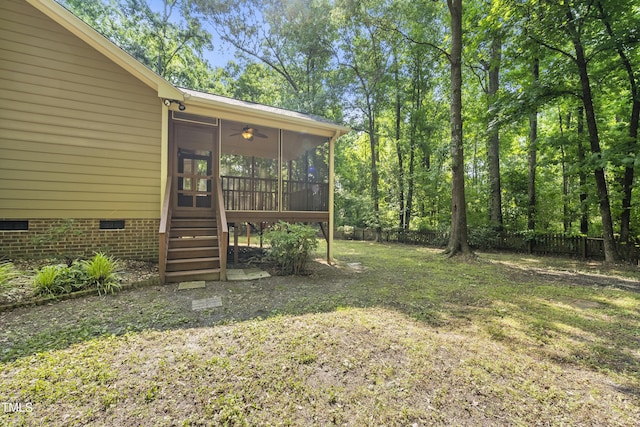 6009 Shadow Moss Cir, Raleigh, NC 27603 - view of yard featuring a sunroom, ceiling fan, and stairway