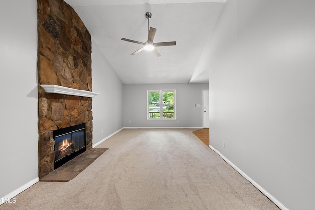 6009 Shadow Moss Cir, Raleigh, NC 27603 - unfurnished living room with a ceiling fan, a fireplace, carpet, baseboards, and vaulted ceiling