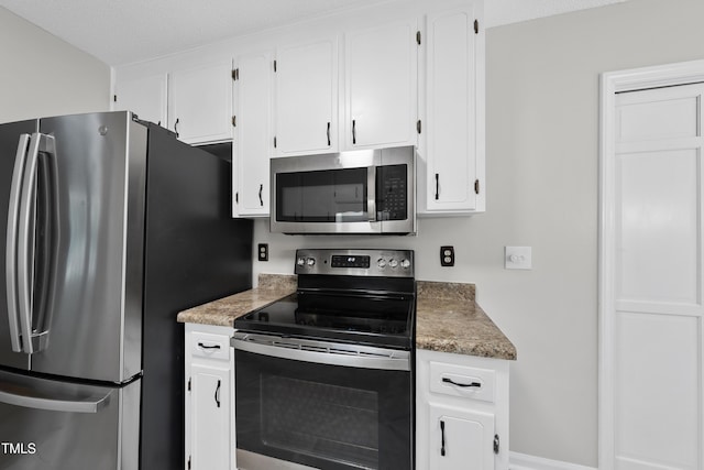 6009 Shadow Moss Cir, Raleigh, NC 27603 - kitchen featuring stainless steel appliances and white cabinets
