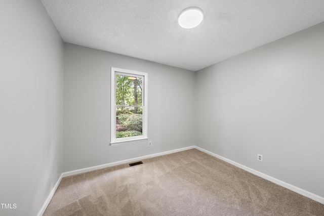 6009 Shadow Moss Cir, Raleigh, NC 27603 - carpeted spare room with baseboards and a textured ceiling