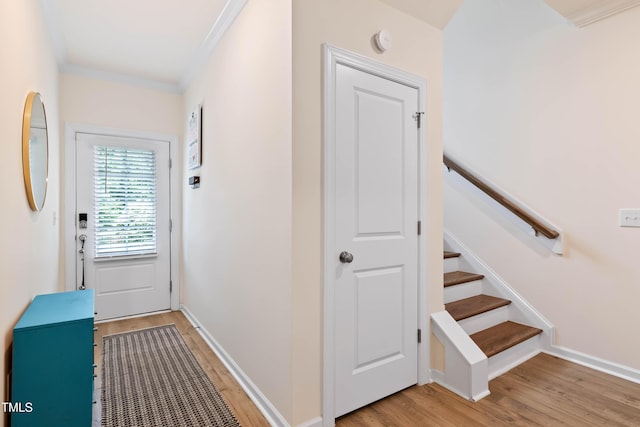6928 Leesville Rd, Raleigh, NC 27613 - hallway with light wood-style floors, crown molding, and stairs