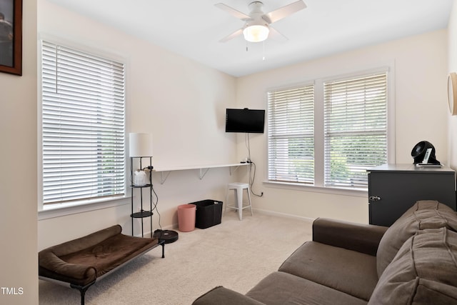 6928 Leesville Rd, Raleigh, NC 27613 - carpeted living room featuring a ceiling fan and baseboards