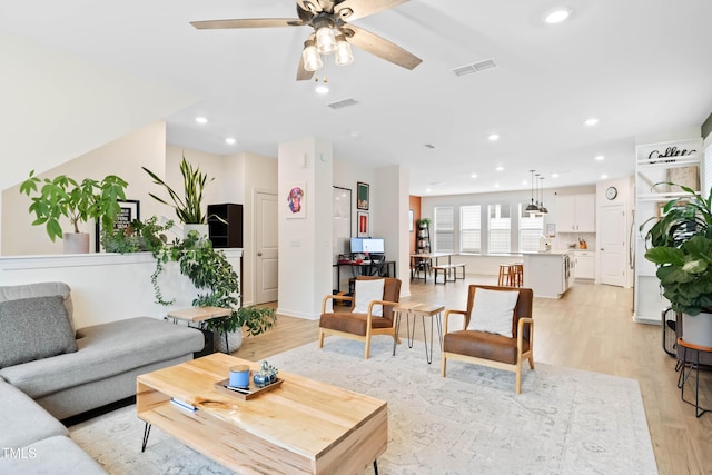6928 Leesville Rd, Raleigh, NC 27613 - living room featuring light wood-style floors, ceiling fan, and recessed lighting