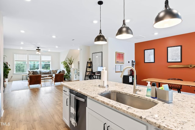 6928 Leesville Rd, Raleigh, NC 27613 - kitchen featuring dishwasher, recessed lighting, hanging light fixtures, ceiling fan, and white cabinets
