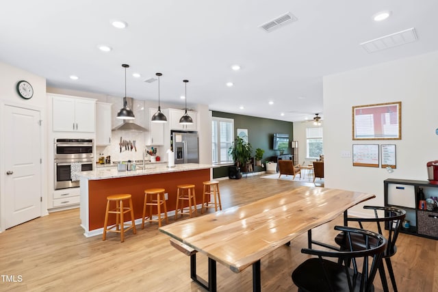 6928 Leesville Rd, Raleigh, NC 27613 - dining space featuring recessed lighting, light wood-style flooring, and a ceiling fan