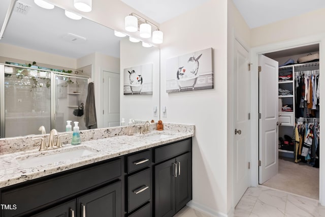 6928 Leesville Rd, Raleigh, NC 27613 - full bath with double vanity, a shower stall, a spacious closet, and marble finish flooring
