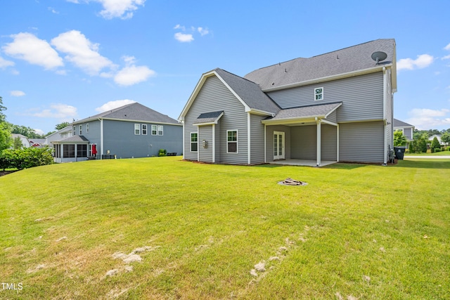 33 E Ravano Dr, Clayton, NC 27527 - rear view of house with a patio and a lawn