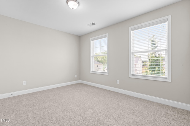 33 E Ravano Dr, Clayton, NC 27527 - carpeted spare room featuring plenty of natural light and baseboards
