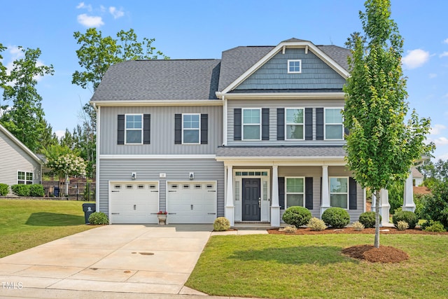 33 E Ravano Dr, Clayton, NC 27527 - view of front of home with concrete driveway, an attached garage, a front yard, a porch, and a shingled roof