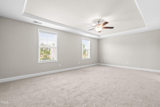 33 E Ravano Dr, Clayton, NC 27527 - unfurnished room featuring a tray ceiling, ceiling fan, and baseboards