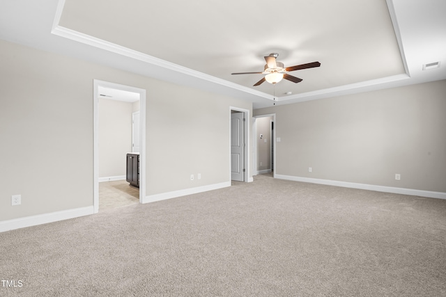 33 E Ravano Dr, Clayton, NC 27527 - spare room featuring a raised ceiling, a ceiling fan, ornamental molding, light colored carpet, and baseboards