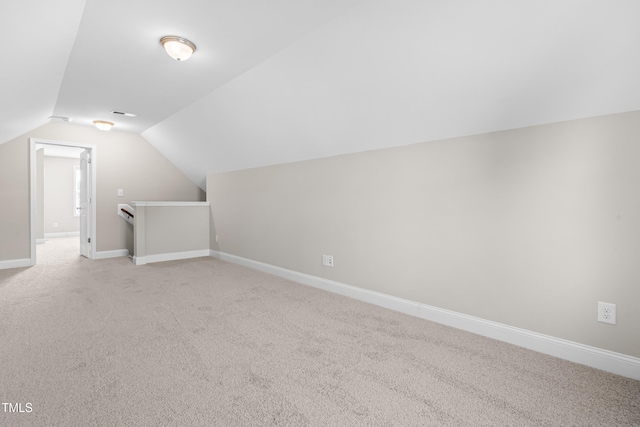 33 E Ravano Dr, Clayton, NC 27527 - bonus room with lofted ceiling, light carpet, and baseboards