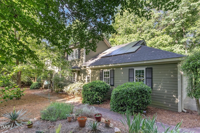 850 N Langdon, Pittsboro, NC 27312 - view of front of home with roof with shingles and solar panels