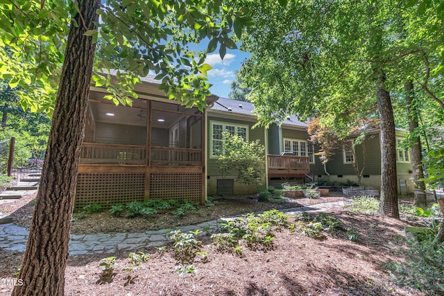 850 N Langdon, Pittsboro, NC 27312 - back of property featuring crawl space, a wooden deck, and a sunroom