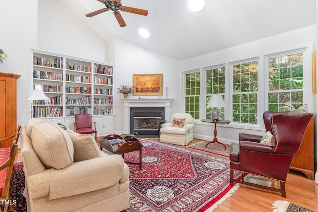 850 N Langdon, Pittsboro, NC 27312 - living area with wood finished floors, a ceiling fan, a glass covered fireplace, high vaulted ceiling, and recessed lighting