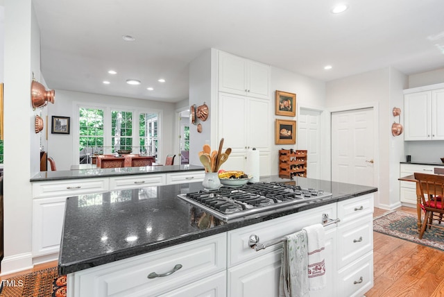 850 N Langdon, Pittsboro, NC 27312 - kitchen featuring stainless steel gas stovetop, light wood-style flooring, recessed lighting, white cabinets, and a kitchen island