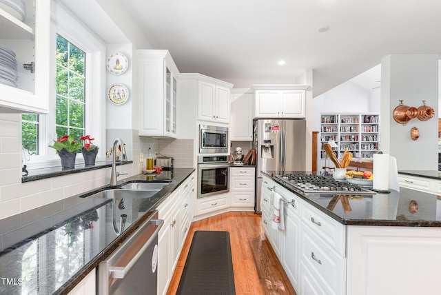 850 N Langdon, Pittsboro, NC 27312 - kitchen with stainless steel appliances, a sink, white cabinets, a kitchen island, and light wood-style floors