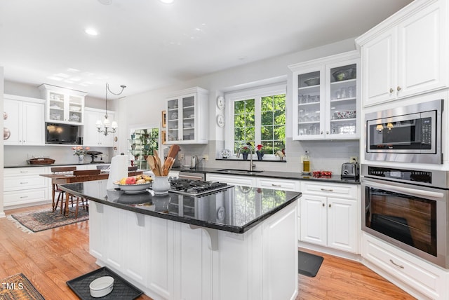 850 N Langdon, Pittsboro, NC 27312 - kitchen featuring appliances with stainless steel finishes, a sink, white cabinetry, light wood-style floors, and recessed lighting