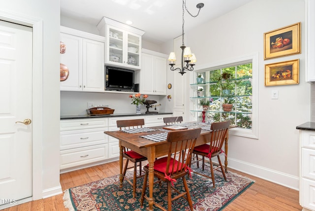 850 N Langdon, Pittsboro, NC 27312 - dining space featuring light wood-type flooring, a chandelier, and baseboards