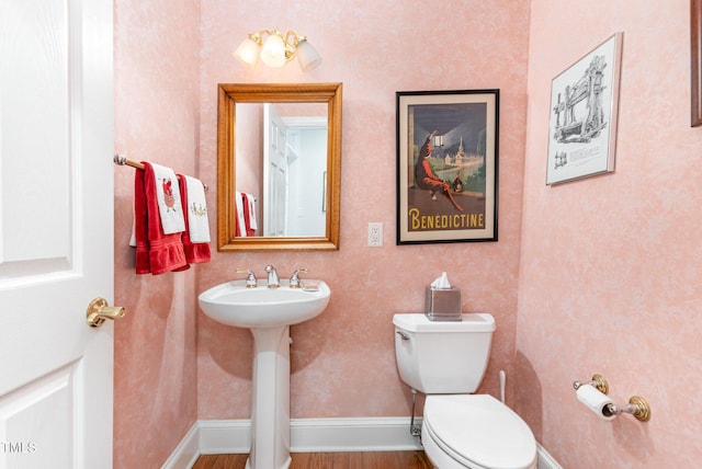 850 N Langdon, Pittsboro, NC 27312 - half bath featuring toilet, wood finished floors, a sink, and baseboards