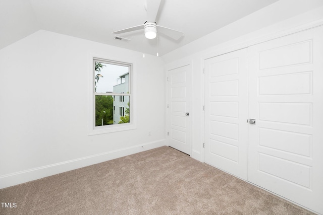1621 Ella Wiggins Way, Raleigh, NC 27603 - unfurnished bedroom with carpet, baseboards, a closet, and lofted ceiling