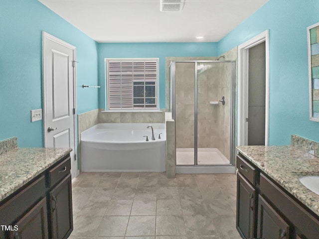 617 Hiddenbrook Dr, Durham, NC 27703 - bathroom with a shower stall, a bath, and vanity