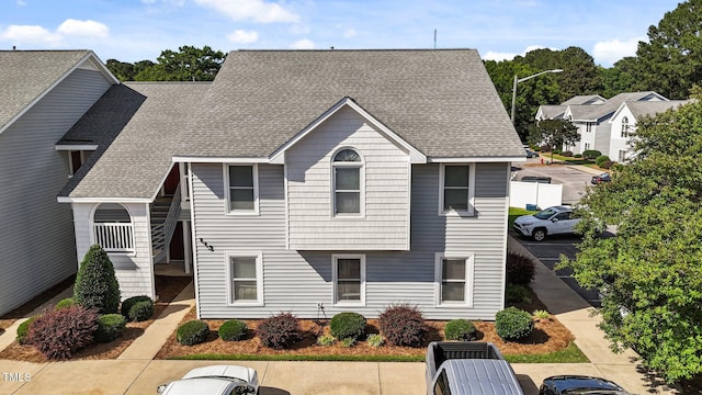 113 W Victoria Ct Unit C, Greenville, NC 27834 - view of front of home with uncovered parking and a shingled roof