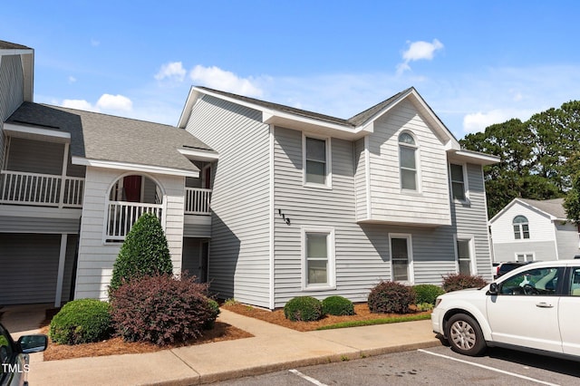 113 W Victoria Ct Unit C, Greenville, NC 27834 - view of front of house featuring uncovered parking and roof with shingles