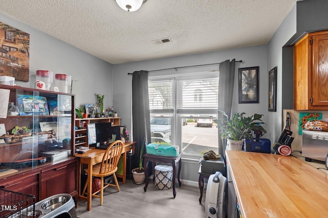 113 W Victoria Ct Unit C, Greenville, NC 27834 - home office with a textured ceiling and light wood finished floors