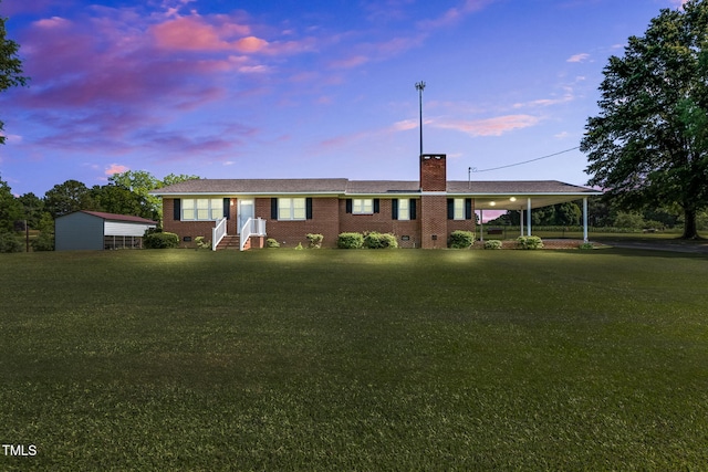 6080 US-421 N, Lillington, NC 27546 - view of front of house with a chimney, entry steps, a yard, brick siding, and crawl space