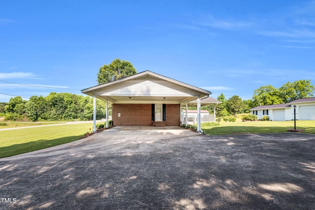 6080 US-421 N, Lillington, NC 27546 - view of front facade featuring asphalt driveway, a front yard, and brick siding