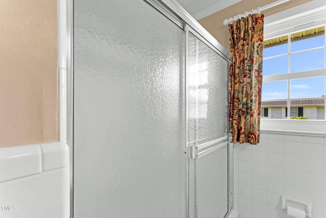 6080 US-421 N, Lillington, NC 27546 - bathroom with an enclosed shower, tile walls, and crown molding