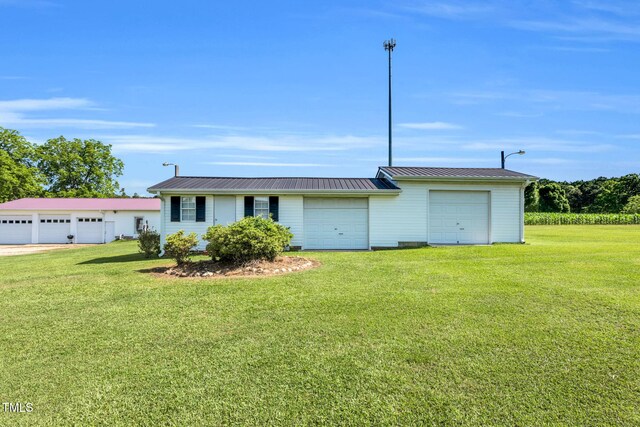 6080 US-421 N, Lillington, NC 27546 - view of front facade with a front yard and metal roof