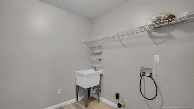 21 Dinghy Dr, Sanford, NC 27332 - laundry area featuring hookup for a washing machine, light wood-type flooring, and baseboards