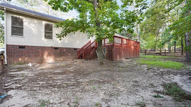 21 Dinghy Dr, Sanford, NC 27332 - back of property with crawl space, a deck, and stairway