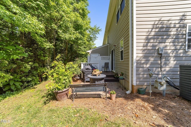 34 Tannenbaum Cir, Greensboro, NC 27410 - view of yard featuring central AC unit and a wooden deck