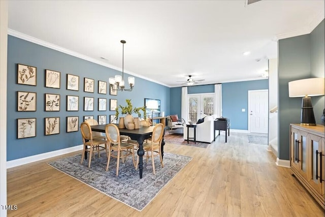 209 Broomgrove Way, Wake Forest, NC 27587 - dining area with crown molding, a chandelier, light wood-type flooring, ceiling fan, and baseboards