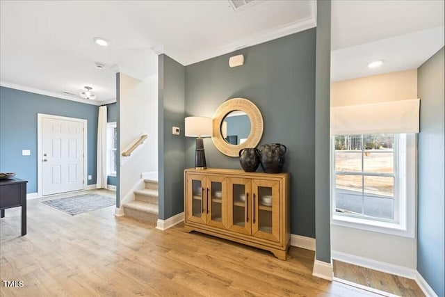209 Broomgrove Way, Wake Forest, NC 27587 - entrance foyer with crown molding, wood finished floors, stairway, baseboards, and recessed lighting