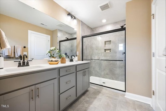 209 Broomgrove Way, Wake Forest, NC 27587 - bathroom with a shower stall, double vanity, tile patterned flooring, and baseboards