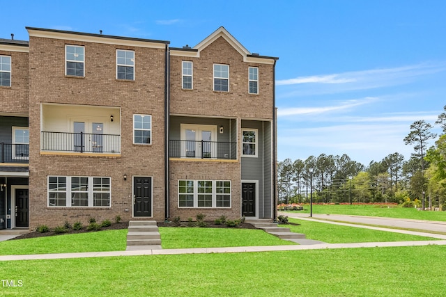 209 Broomgrove Way, Wake Forest, NC 27587 - view of property featuring a front yard and brick siding